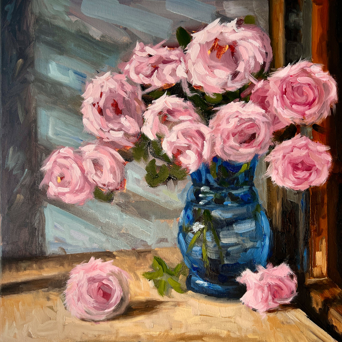 "Pink Roses" original oil painting by John Wellington — full view of pink roses in a cobalt glass vase on a sunlit wooden table