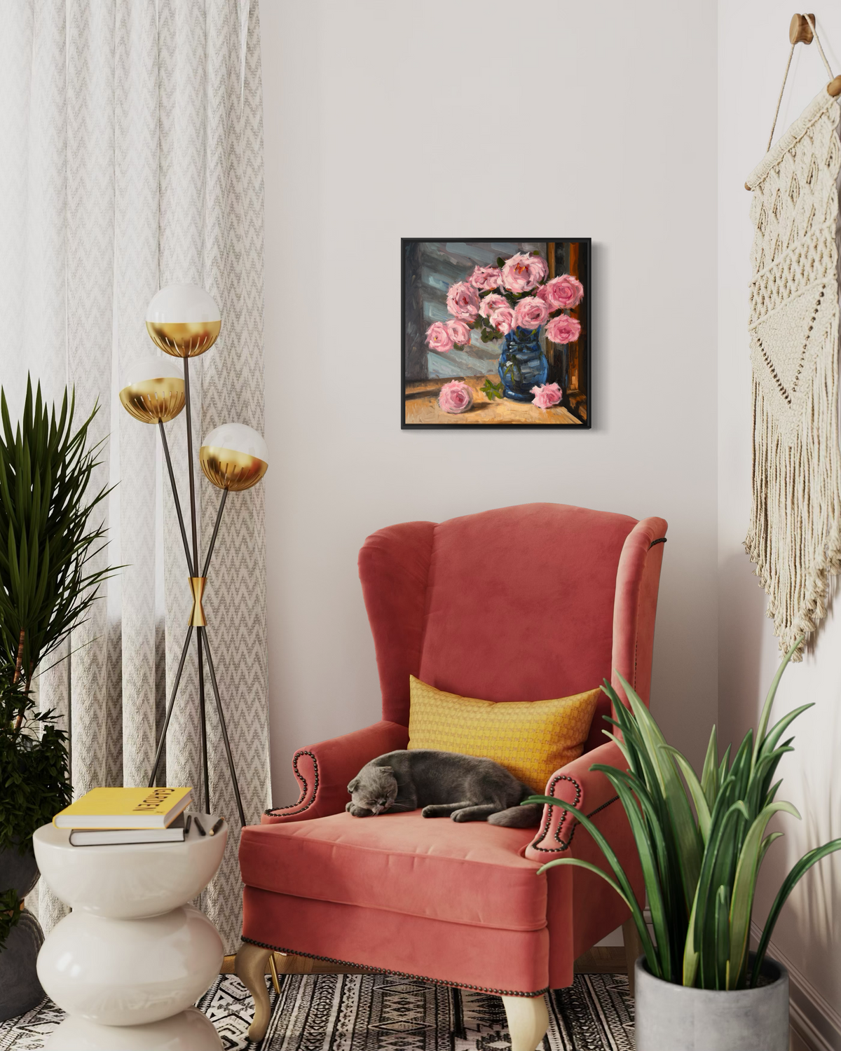 "Pink Roses" original oil painting by John Wellington — framed in a cozy reading corner with a coral armchair