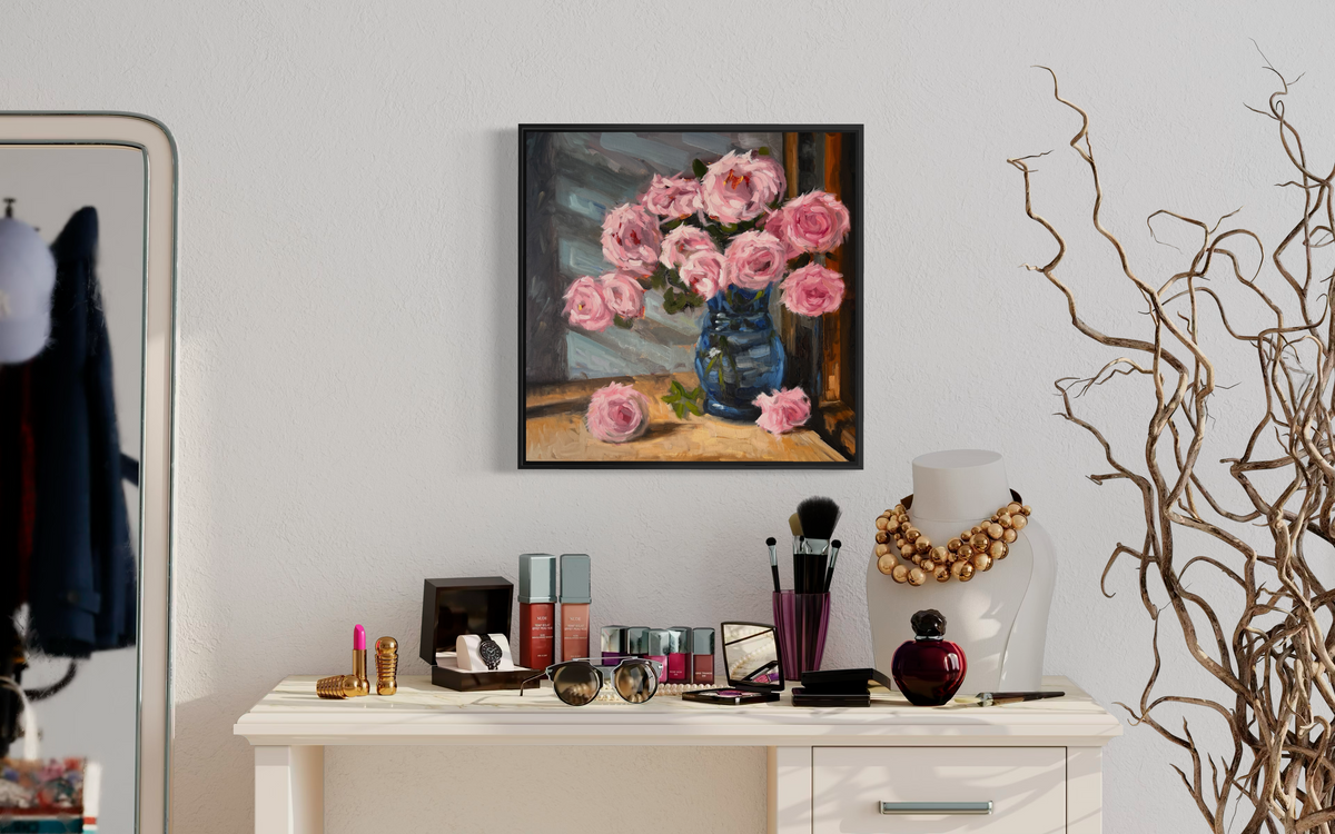 "Pink Roses" original oil painting by John Wellington — framed above a vanity with jewelry and perfume