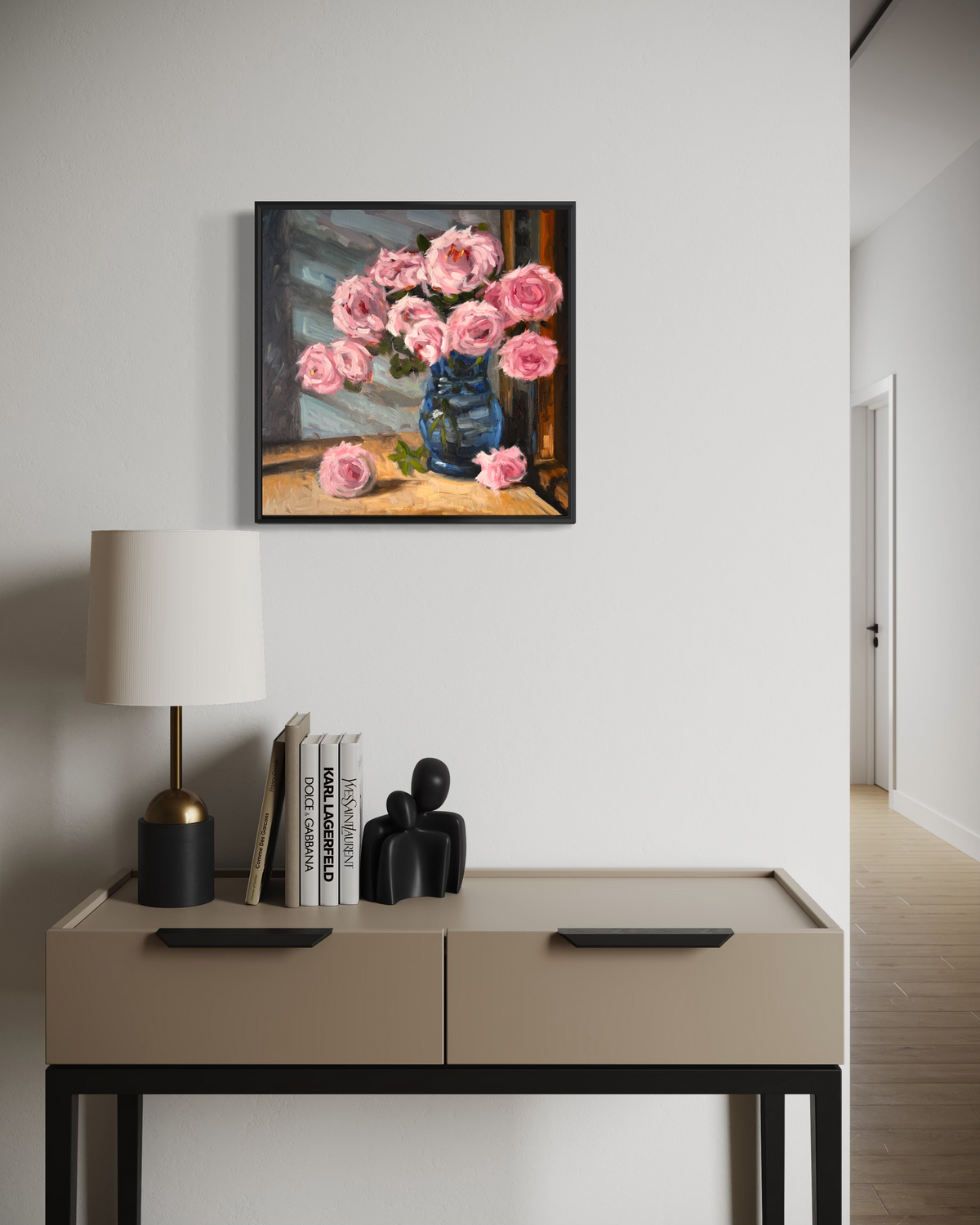 "Pink Roses" original oil painting by John Wellington — framed in an entryway above a modern console table